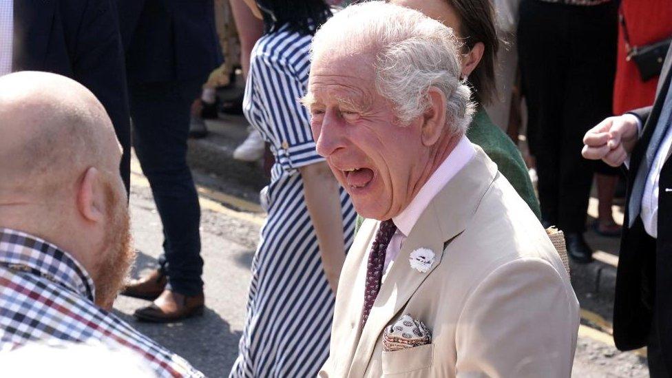 King Charles chats with locals in the town centre