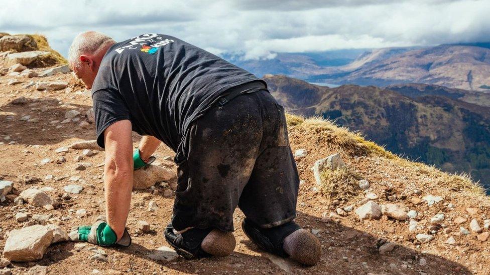 Double amputee Paul Ellis crawls up Ben Nevis