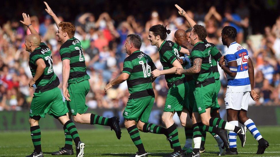 Players from team Shearer celebrate Trevor Sinclair's goal