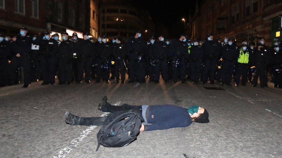 Protester lying in a road