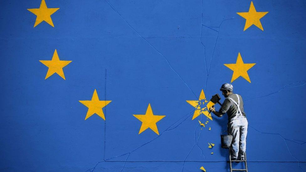 Banksy Brexit artwork of workman chipping away at the EU flag, Dover, 8 May 2017