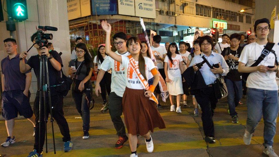 Yau Wai-ching (C) of the Youngspiration political party canvasses for votes in the Kowloon West Geographical Constituency on voting day in the Hong Kong Legislative Council elections 2016