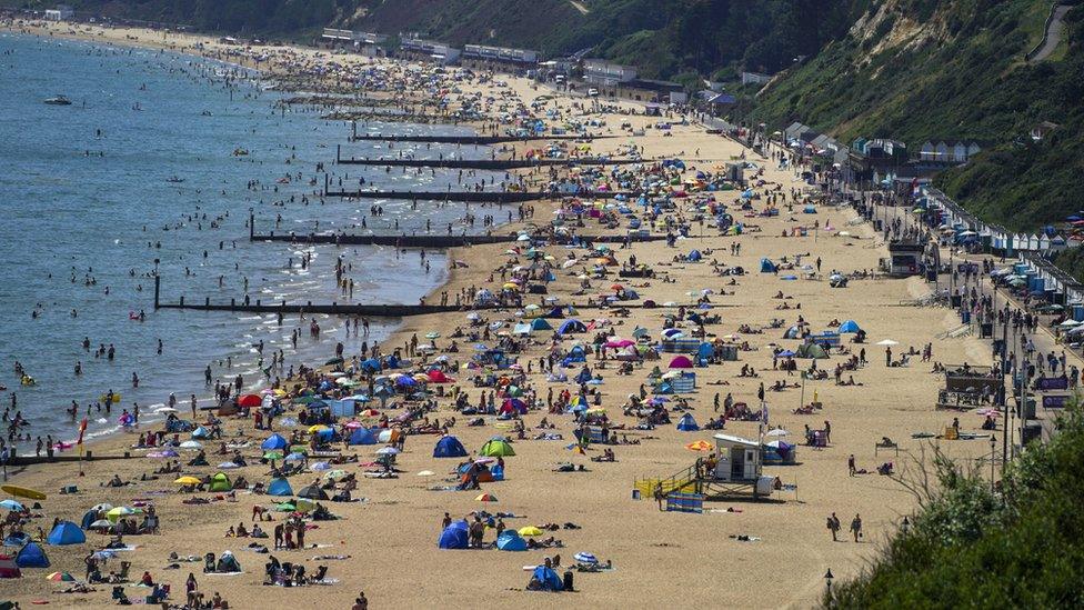 People on Bournemouth beach in Dorset