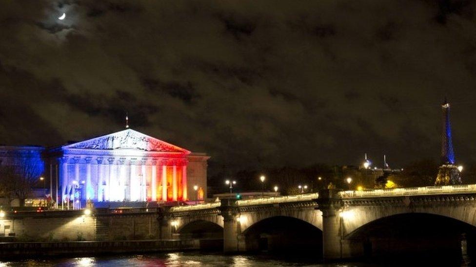 The French National Assembly lit in the colours of the French flag