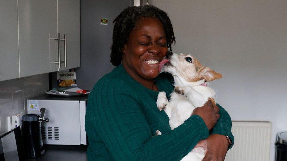 Sharon Telfer with her 15-year-old Jack Russell Mia in the kitchen.