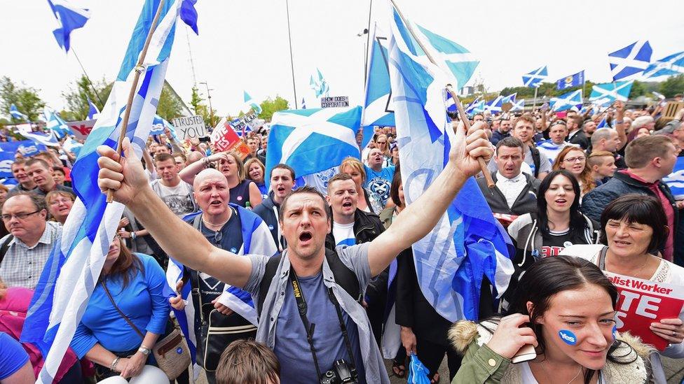 A crowd of Scottish independence supporters waiving Scottish flags