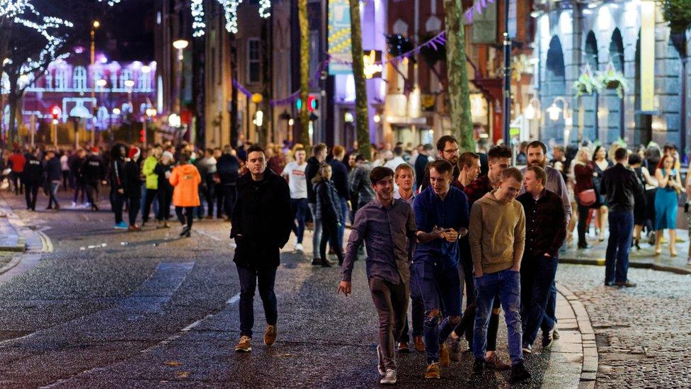 Revellers on Wind Street