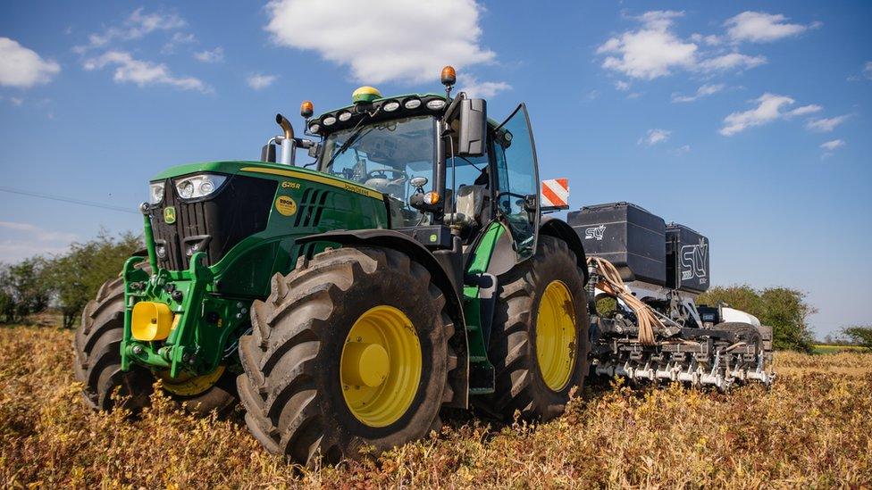 Tractor driving through a field