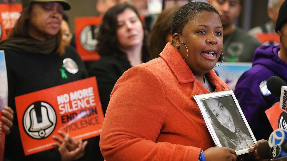 Cleopatra Cowley-Pendleton holds a picture of her daughter Hadiya, 15, while speaking at a gathering of gun violence victims