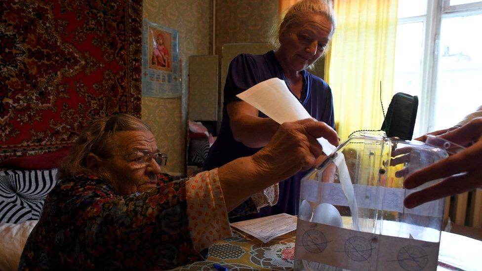 Woman votes at home in Moscow - 18 September