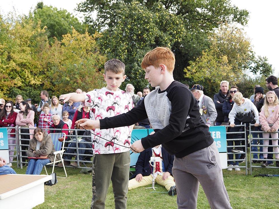 Two children in a conker battle