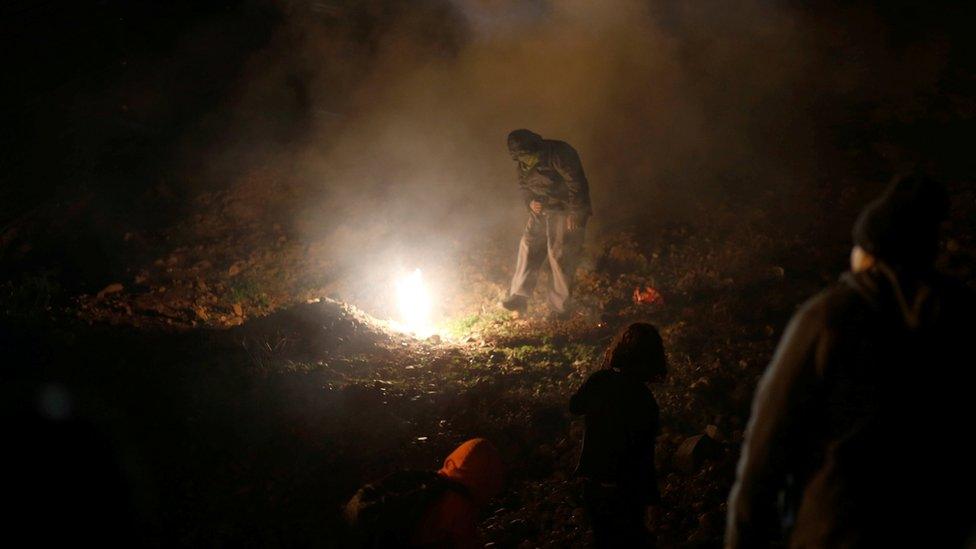 US border agents fire tear gas at migrants on the Mexican border