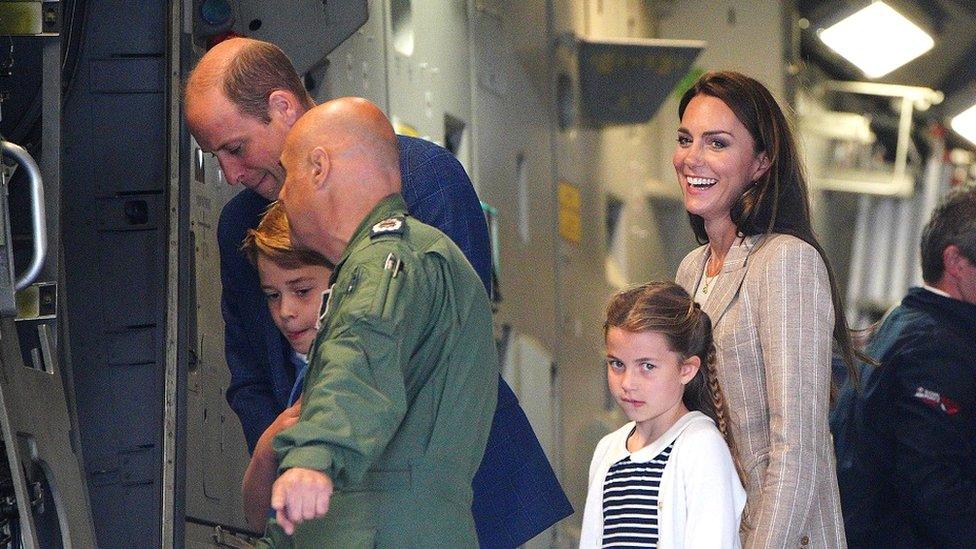 The Prince and Princess of Wales inside a military plane