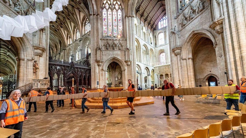 A table made from the wood of a 5,000-year-old oak tree enters Ely Cathedral