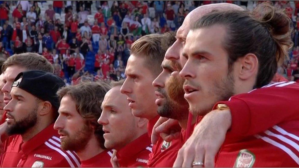 Wales players sing the anthem