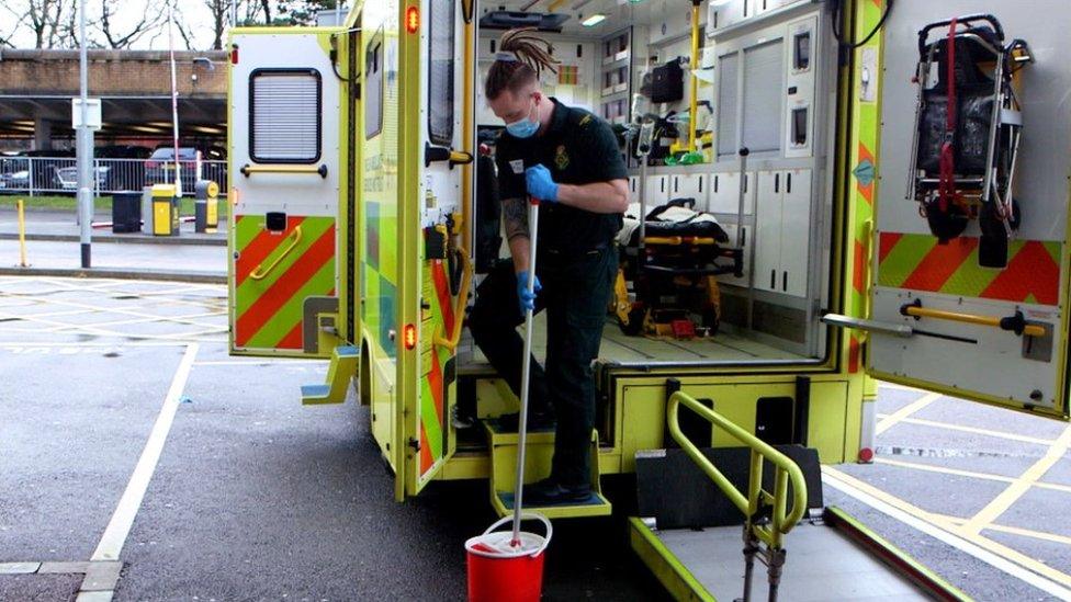 Paramedic cleans ambulance