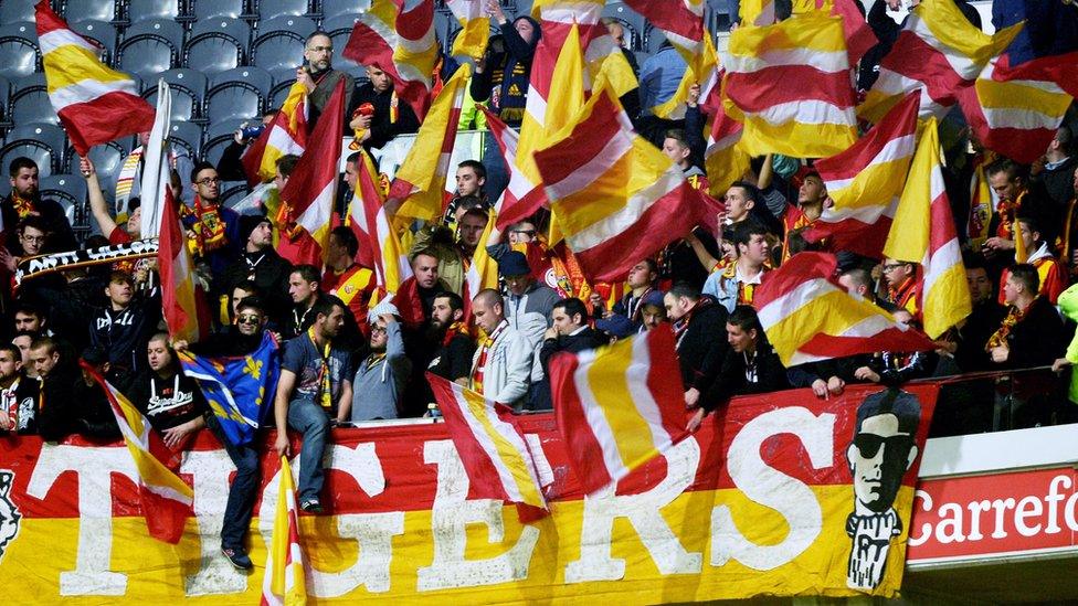 Len's supporters cheer before a match against local rivals Lille