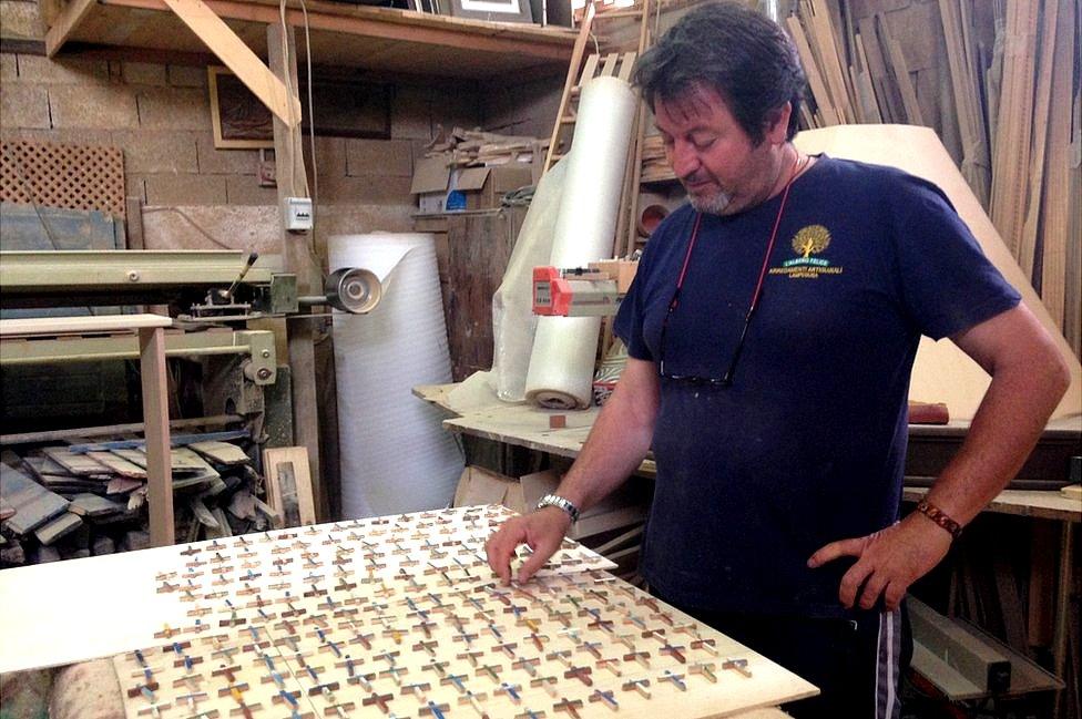 Lampedusa carpenter Francesco Tuccio with some of the crosses