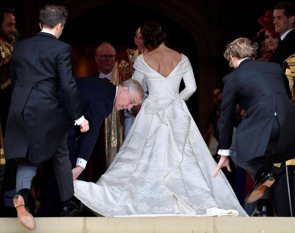 Princess Eugenie arrives accompanied by her father Prince Andrew, Duke of York, at St George"s Chapel for her wedding to Jack Brooksbank in Windsor Castle