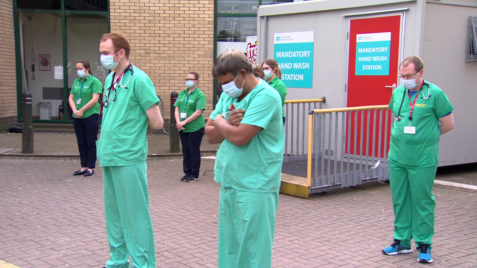 Staff gathered outside Antrim Area Hospital at midday to take part in the minute's silence