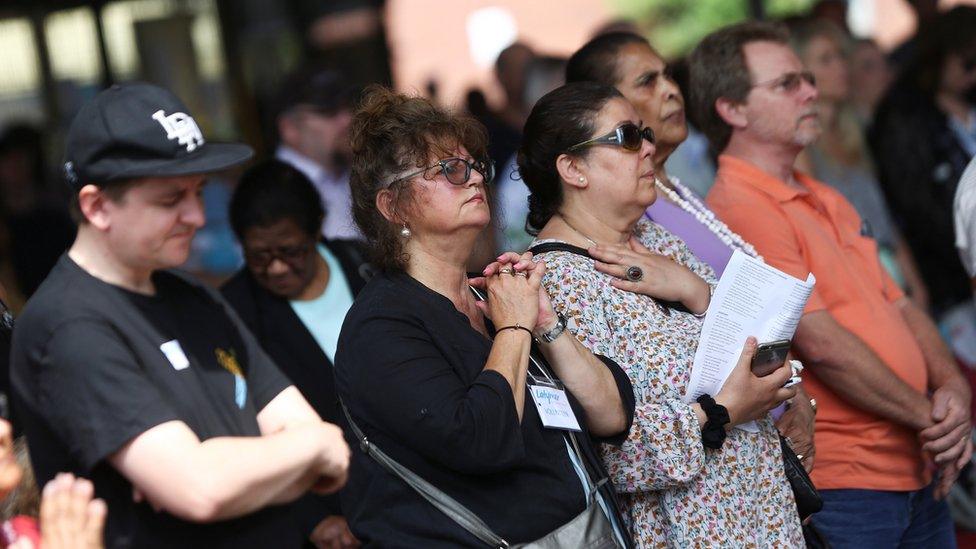 People attend a service at a church near the Grenfell Tower in North Kensington