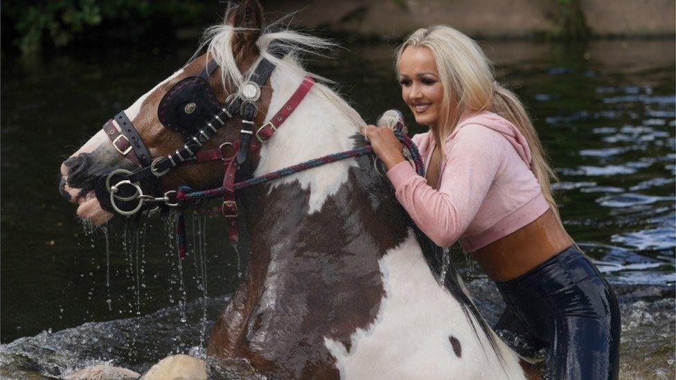 Girl on horse in river