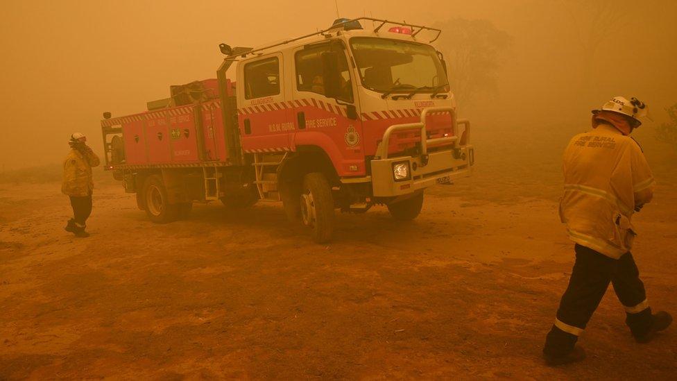 Firefighters and a fire engine near Canberra