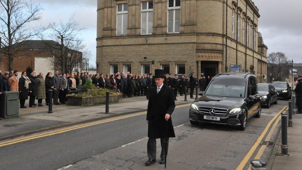 A guard of honour ahead of Peter Lawson's funeral