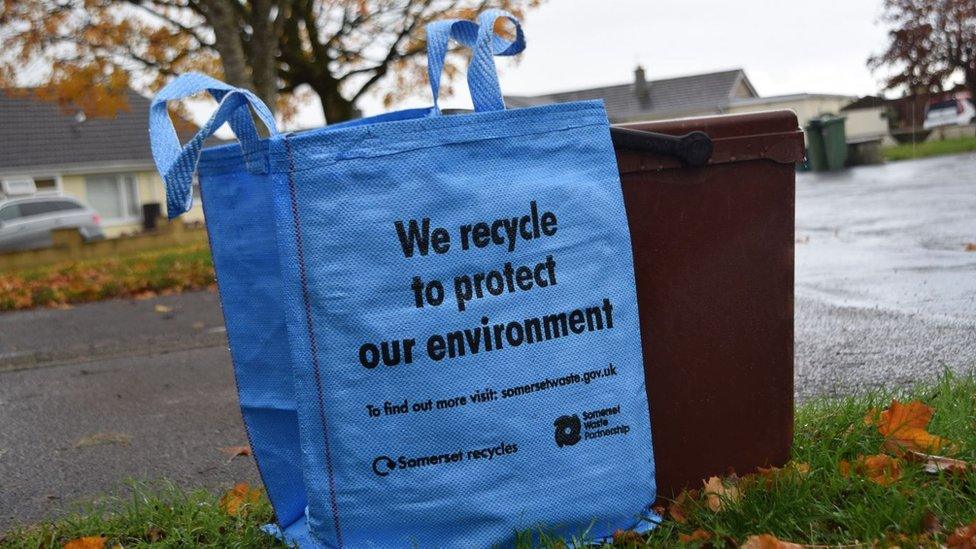 A Bright Blue Bag And Food Waste Caddy Ready For Kerbside Collection