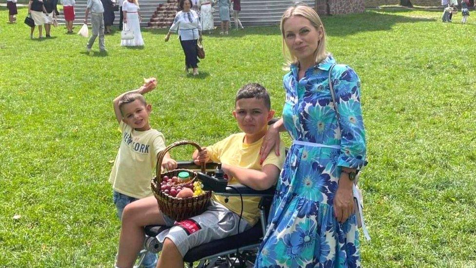 Ms Hevak with her youngest and eldest son in a park