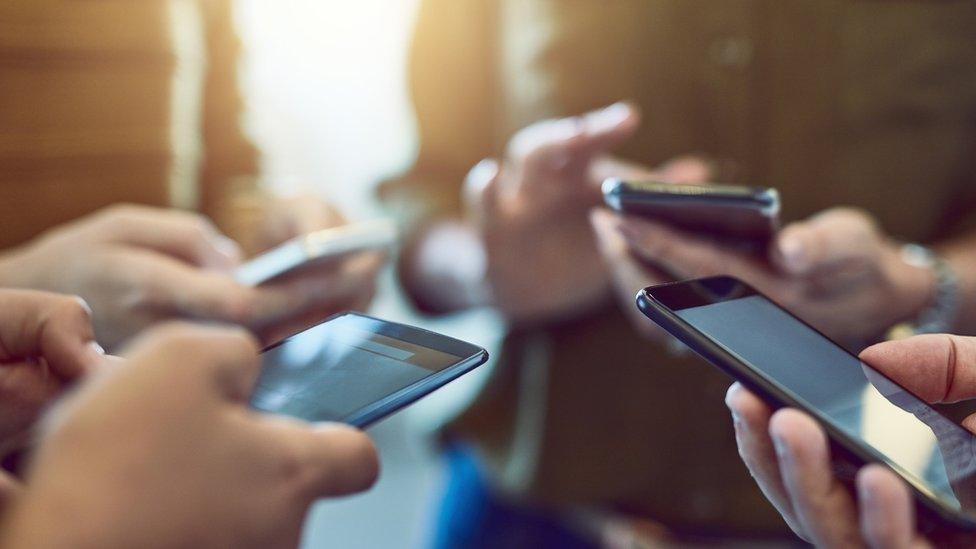 People holding smartphones