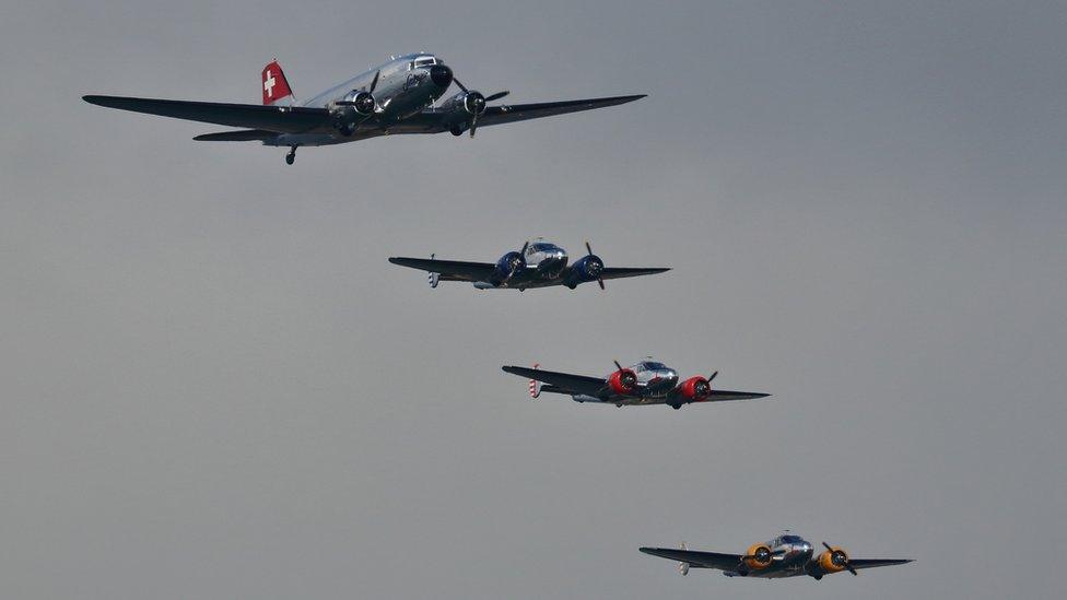 Swissair DC3 and Beech 18s transport planes in formation