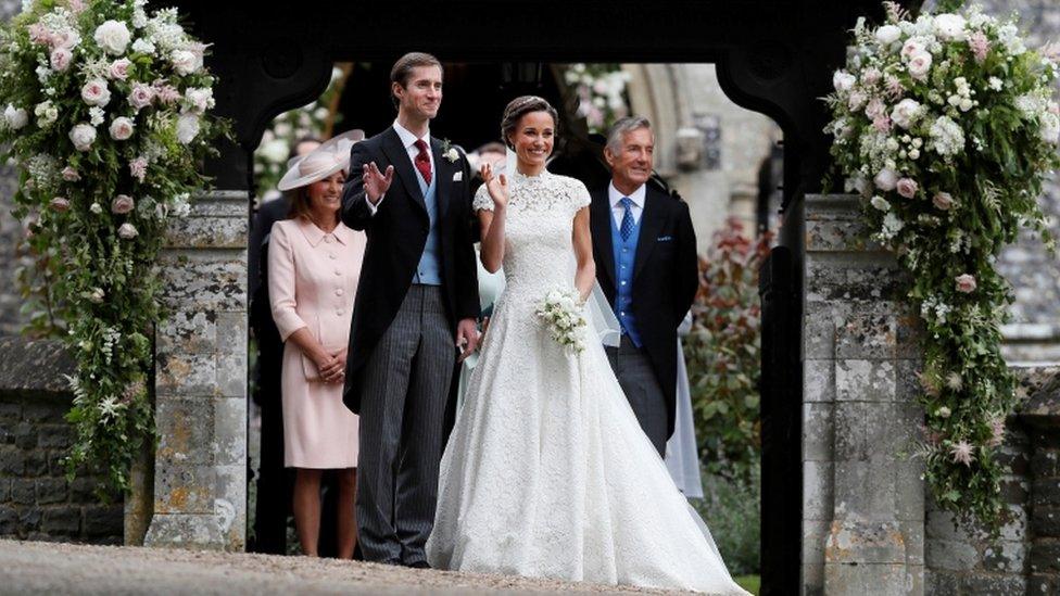 Pippa Middleton and James Matthews pose for photographs after their wedding