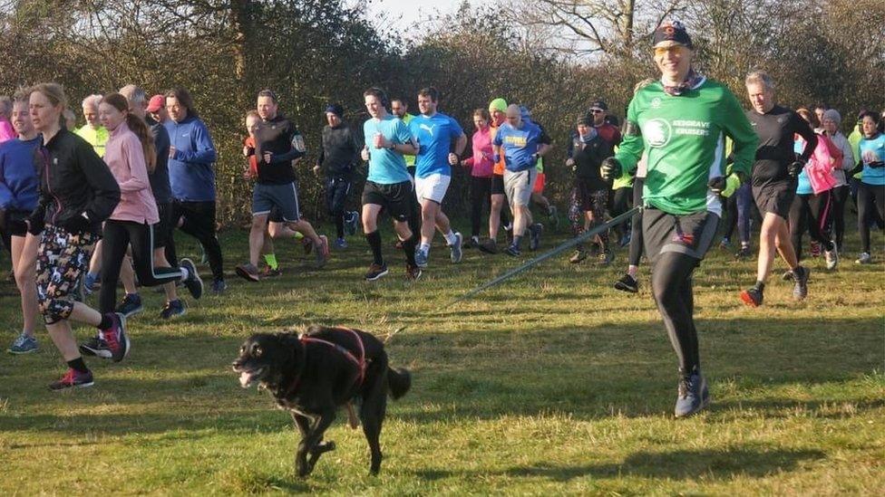 Kevin Ward running with his dog Wilson at the Kesgrave Parkrun