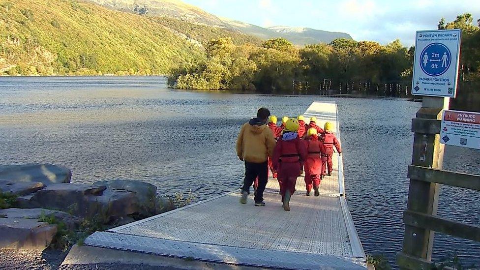 Children walking on jetty