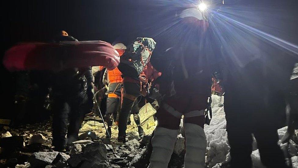 The team setting off in the dark