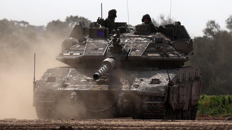 Israeli Merkava tank patrols the southern part of the Israel-Gaza perimeter fence near Khan Younis (23 January 2024)