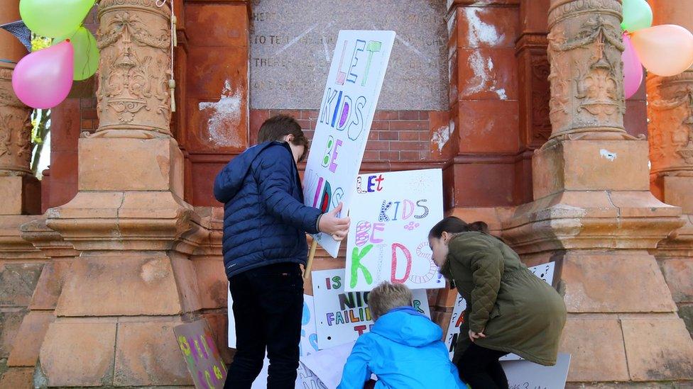 Children with placards at school tests protest