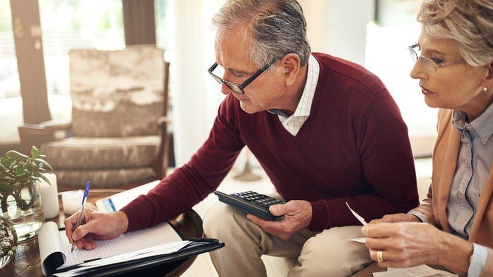 Pensioners doing paperwork