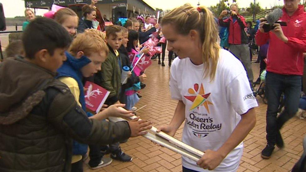 Schoolchildren in Barry touch the baton