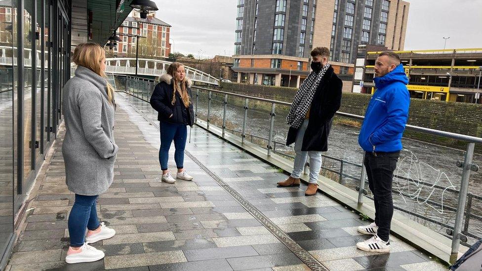 Residents outside the flats