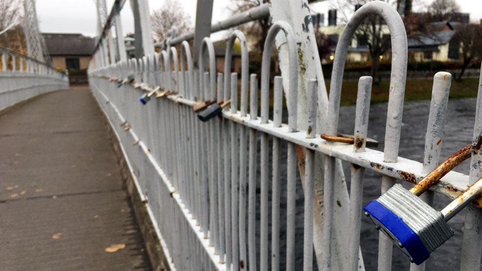 Padlocks on footbridge