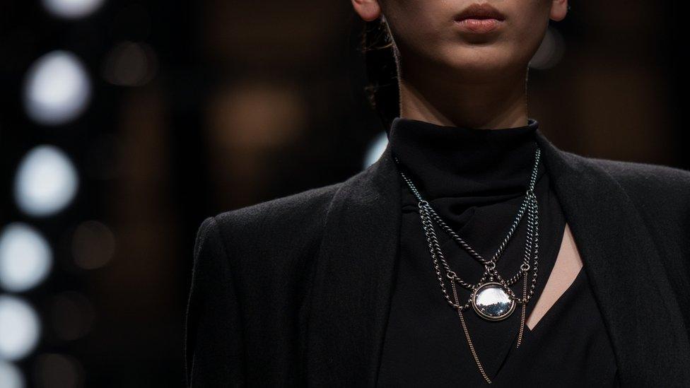 A model takes part in the Antwerp World Diamond Centre fashion show in China, October 2014