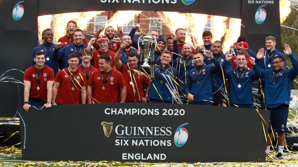 Owen Farrell, the England captain, lifts the Six Nations Trophy.