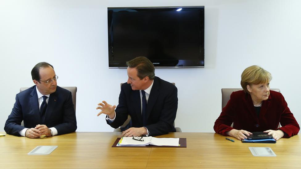 France's President Francois Hollande, Britain's Prime Minister David Cameron and Germany's Chancellor Angela Merkel speak during a meeting to discuss the situation in Ukraine at the European Union Council Building on March 6, 2014 in Brussels