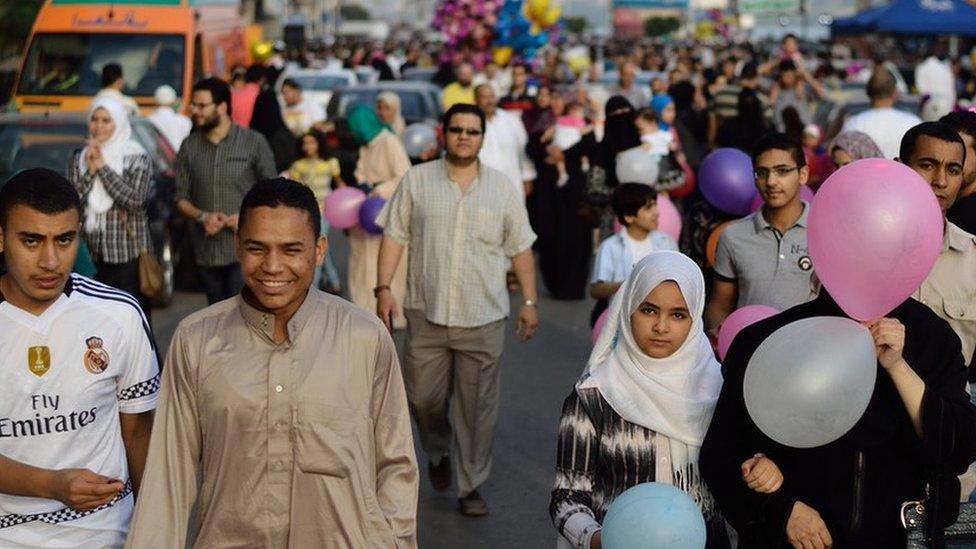 Young people leave a mosque after prayers Al-Mansourah, Egypt. 17 July 2015.