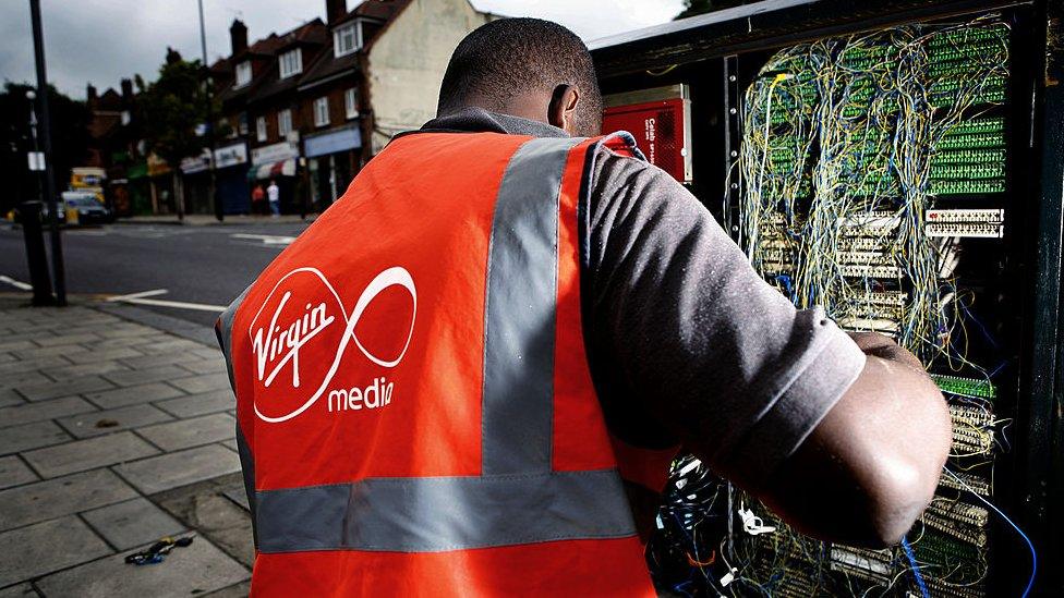 An engineer installing broadband