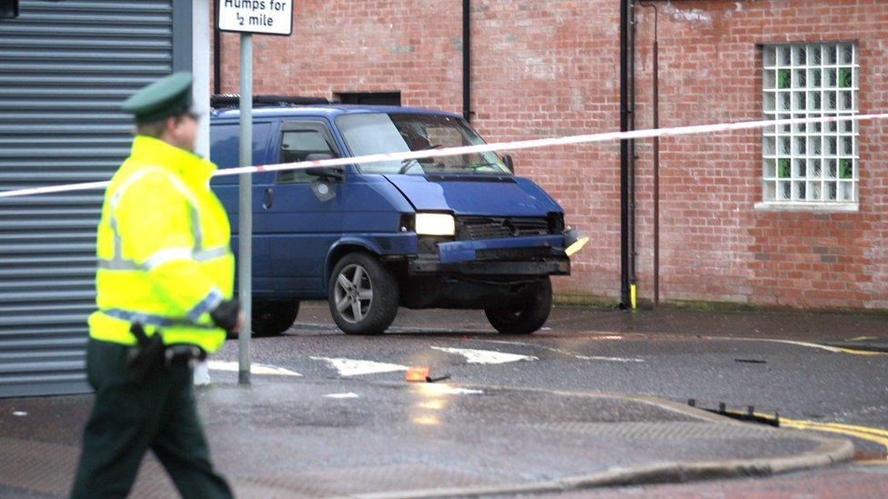 A police officer stands by a cordon at the scene of the bombing