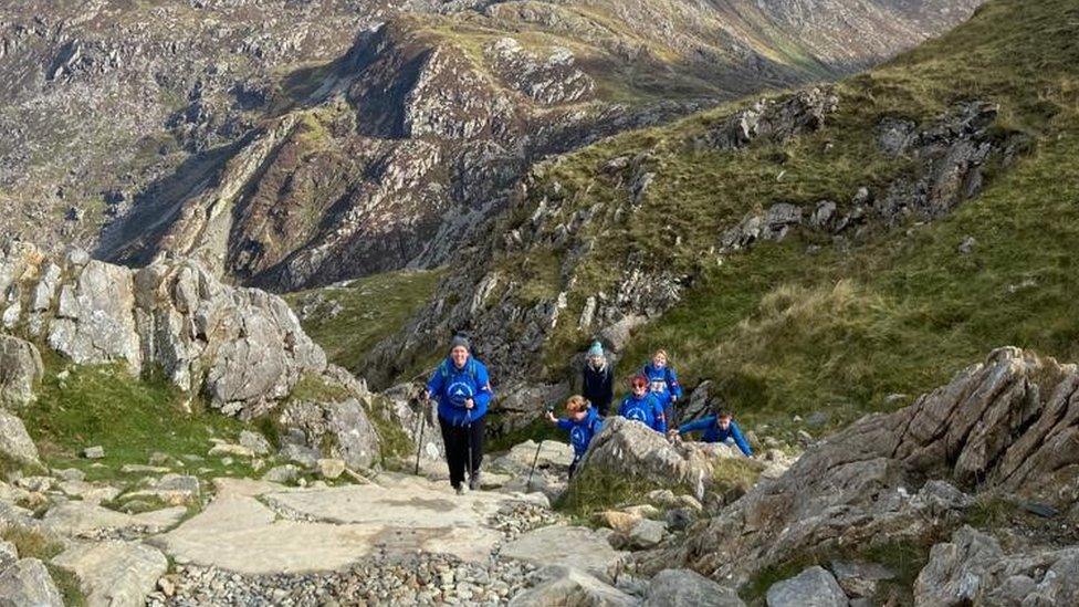 Despite varying levels of fitness and preparation, every member of the group summitted via the challenging Pyg Track route in just 4.5 hours