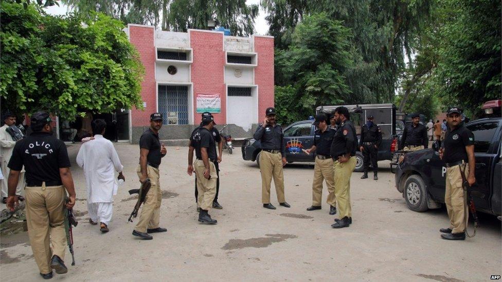 Pakistani police commandos stand outside the hospital where the bodies of Malik Ishaq, an anti-Shiite group leader and other militants have been placed for identification in Muzaffargarh on July 29, 2015.